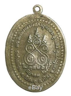 A coin is Lp Thob Temple Chang Puak, Last Generation C. E. 2519, Thai buddha Amulet