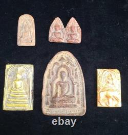 A collection of Buddhist Amulets Thailand Burma monastery gold leaf Elephant art