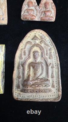 A collection of Buddhist Amulets Thailand Burma monastery gold leaf Elephant art