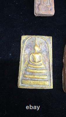 A collection of Buddhist Amulets Thailand Burma monastery gold leaf Elephant art