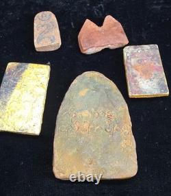 A collection of Buddhist Amulets Thailand Burma monastery gold leaf Elephant art A collection of Buddhist Amulets Thailand Burma monastery gold leaf Elephant art