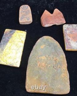A collection of Buddhist Amulets Thailand Burma monastery gold leaf Elephant art