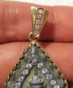 Old Thai Buddha amulet mounted in 18K gold frame with 19 diamonds